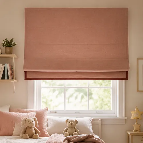 A dusty-pink Roman blind with a deep red trim in a child's bedroom